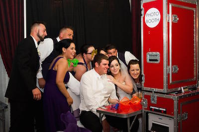 Red Mobile Photo Booth with Wedding Guests getting photographed